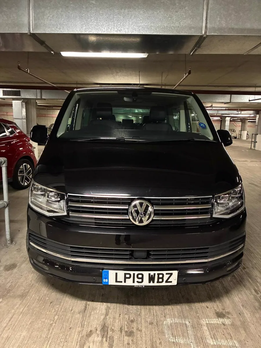 Completed windscreen repair on a black Volkswagen
