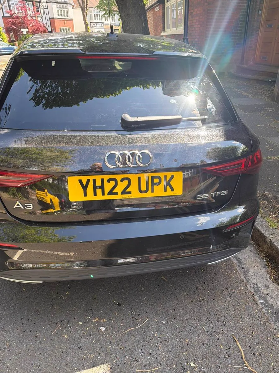 Black Audi after completed rear glass work