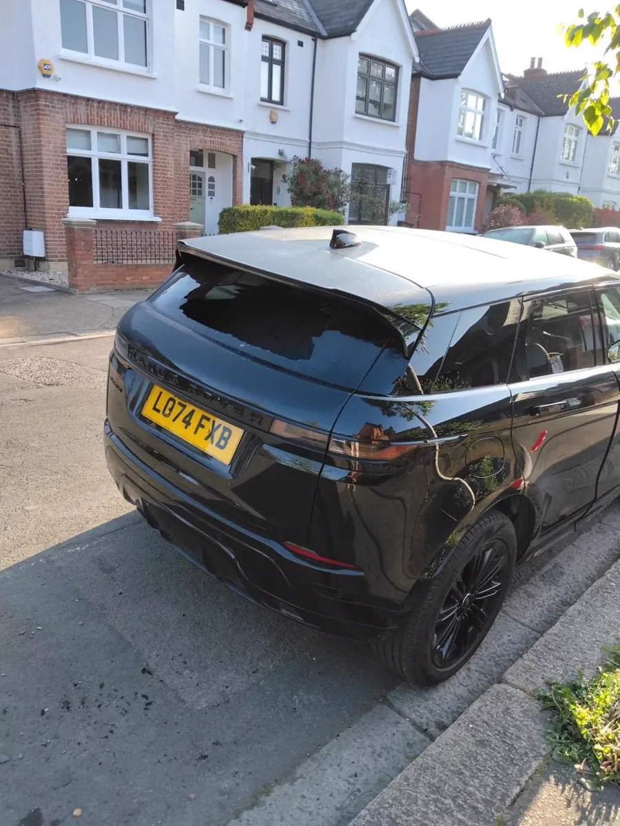 Black vehicle after completed rear windscreen work